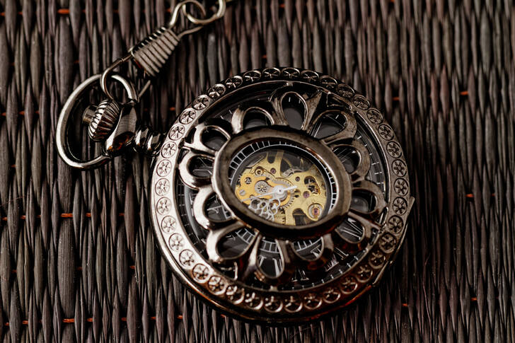 Antique clock on a dark background