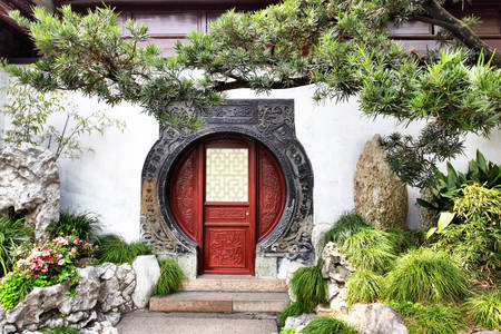 Porte ronde dans le jardin Yu Yuan