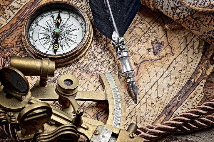 Sextant and compass on an old map