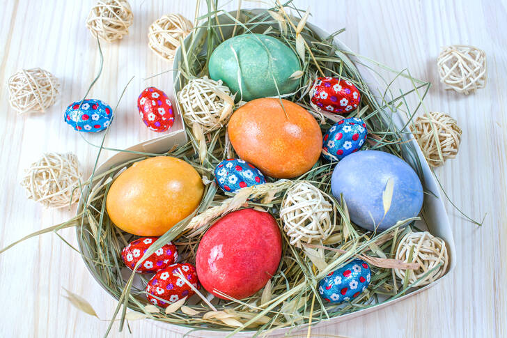 Easter eggs on dry grass