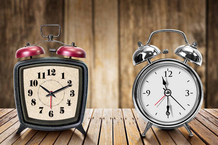 Alarm clocks on a wooden table