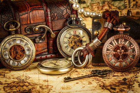 Vintage pocket watch on the map