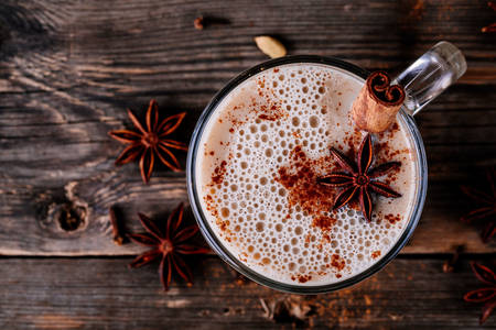 Latte with anise and cinnamon stick