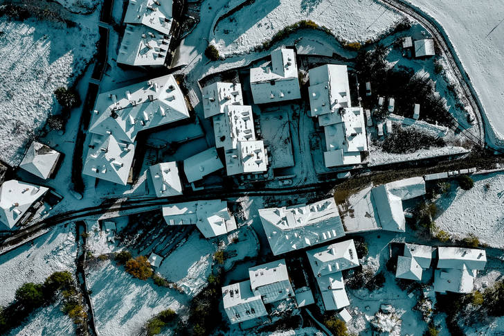 Snow covered roofs of houses