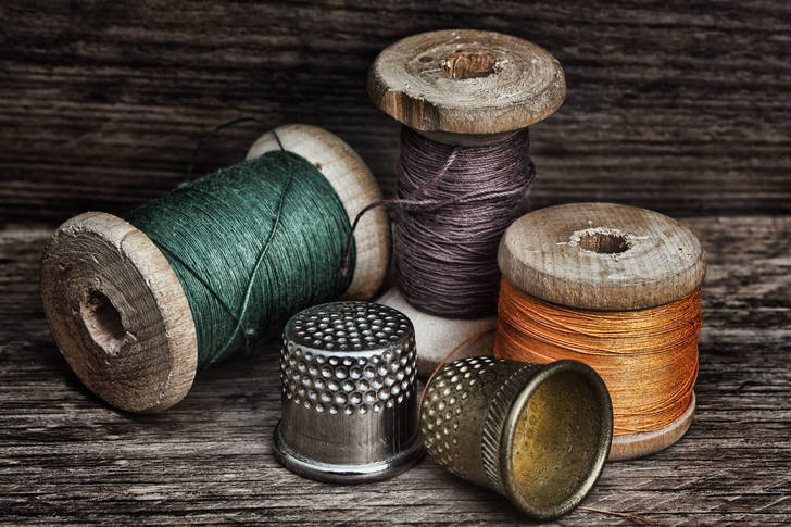 Spools of thread and thimbles