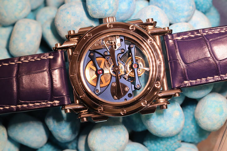 Wrist watch on blue stones