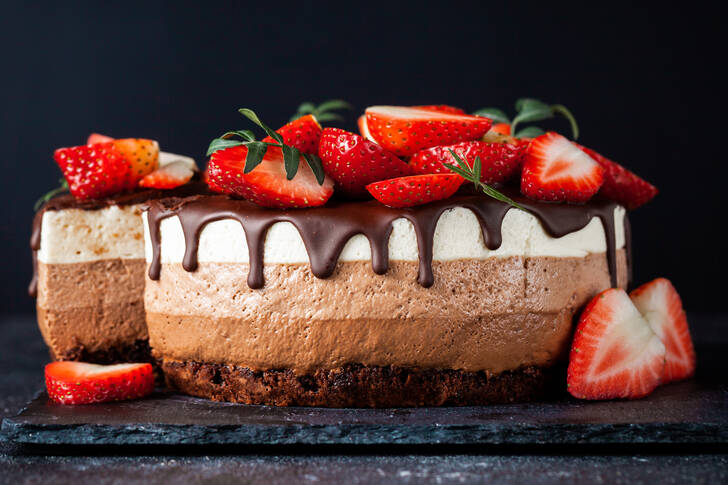 Three chocolate cake with strawberries