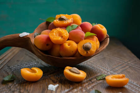 Apricots in a wooden spoon