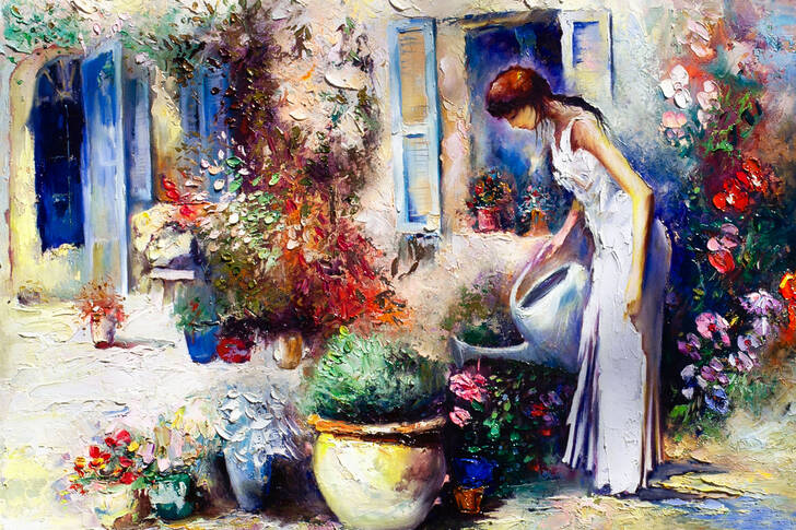 Flicka i en blommande trädgård