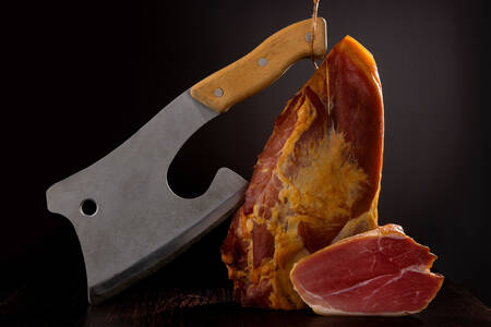 Prosciutto ham with butcher knife