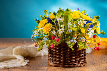 Basket of wildflowers on the table