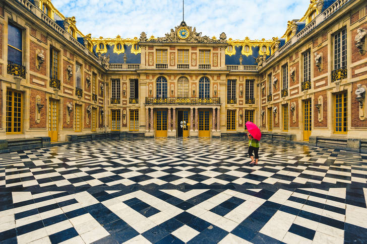 The marble courtyard of the Palace of Versailles