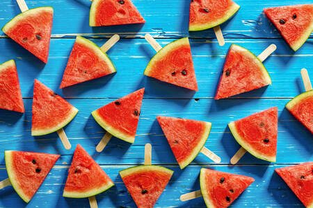 Watermelon slices on blue background