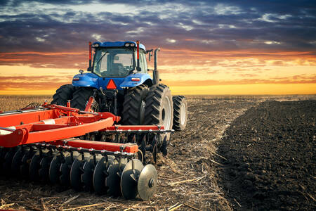 Working tractor in the field