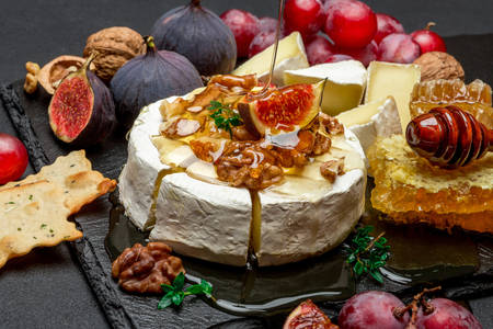 Camembert cheese with fruit and honey