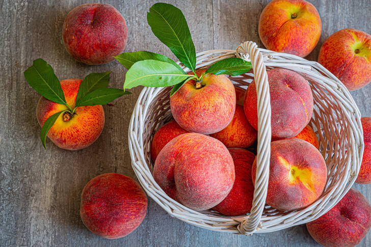 Peaches in a white basket