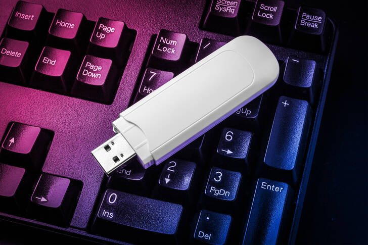 Flash drive on a black keyboard