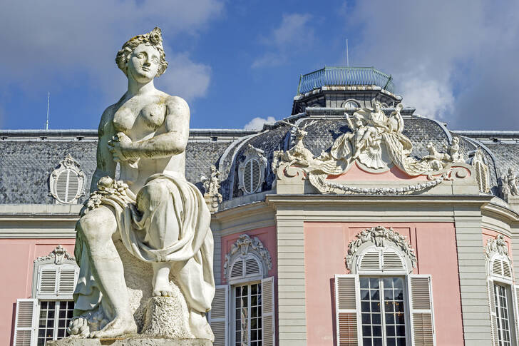 Sculpture against the backdrop of the facade of Benrath Palace