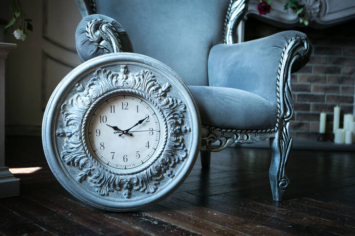 Vintage clock and armchair