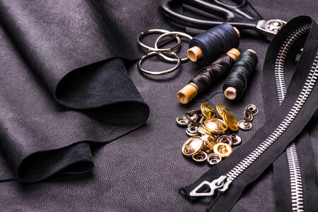 Black leather, threads and buttons