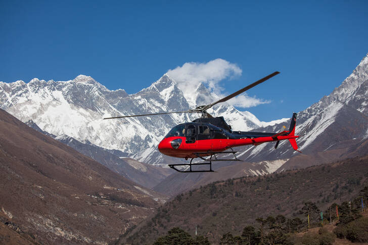 Red and black helicopter