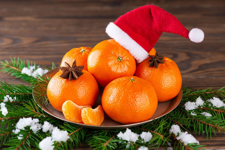 Tangerines with a Santa Claus hat