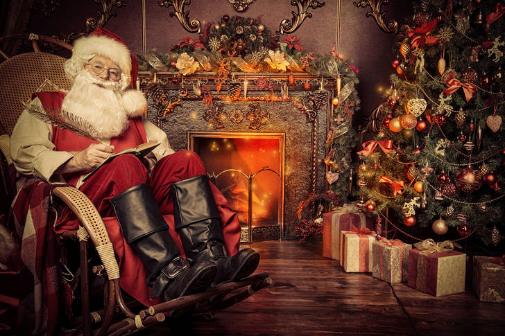 Santa Claus resting by the fireplace