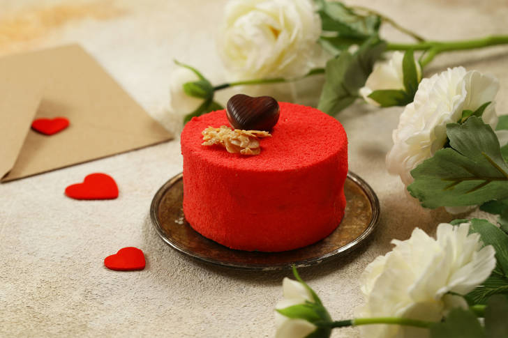 Red cake with chocolate heart