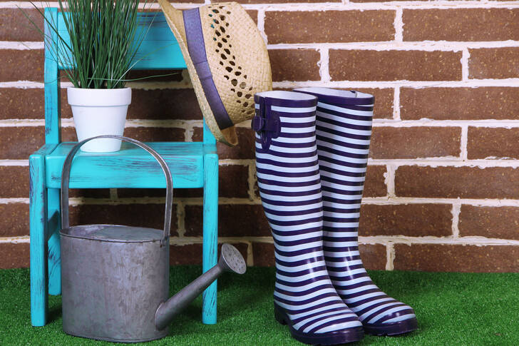 Boots, watering can and hat