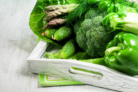 Green vegetables in a wooden tray