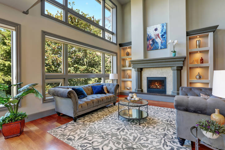 Living room with large windows and fireplace