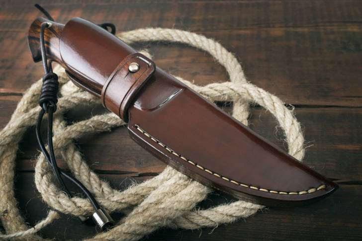 Hunting knife in a leather case