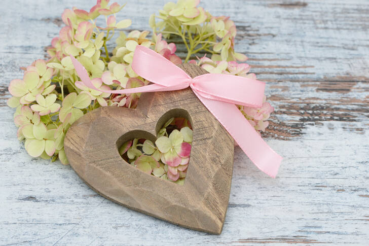 Wooden heart and flowers