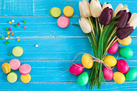 Eggs and tulips on a blue background