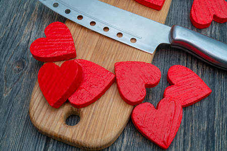 Red hearts on wooden board