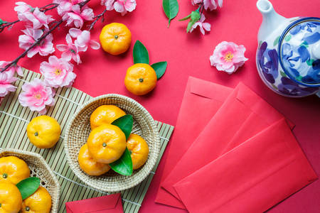 Tangerines and sakura flowers