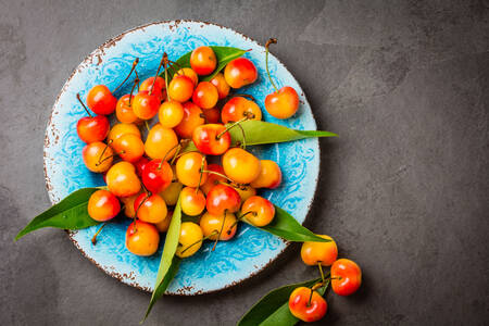 Yellow cherry on a plate