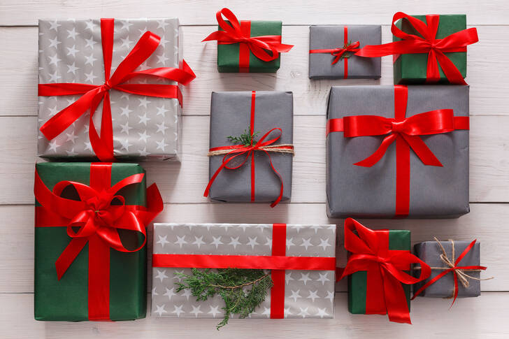 Gifts on a white wooden background