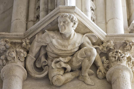 A sculpture of a Basque pelota player at Bayonne Cathedral