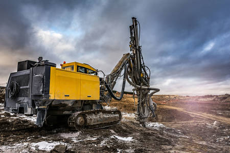 Excavator with drilling rig