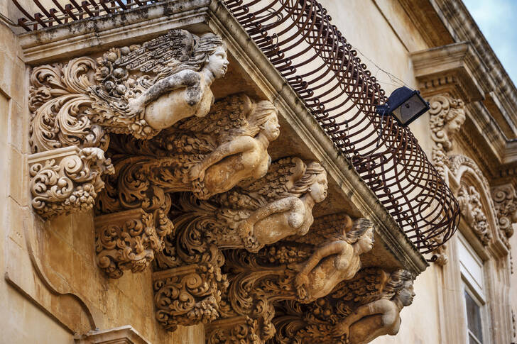 Statues under the balconies