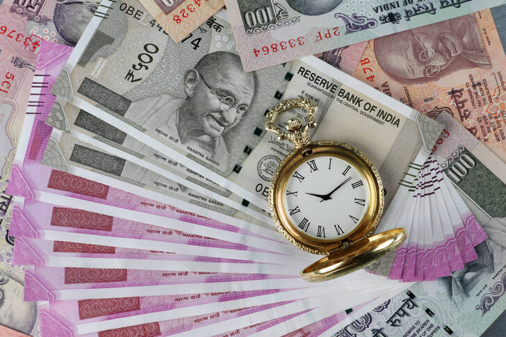 Indian rupees and antique watch