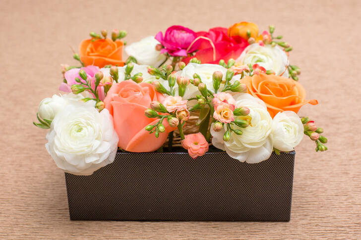 Flower arrangement in a gray box