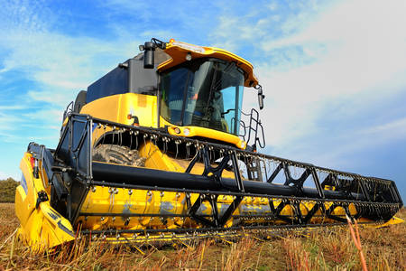 Yellow harvester in the field