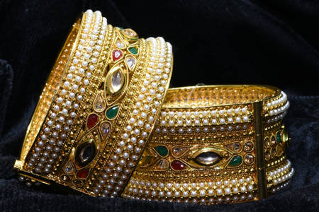 Gold bracelets with stones