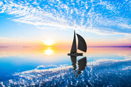 Sailboat at sea at dawn