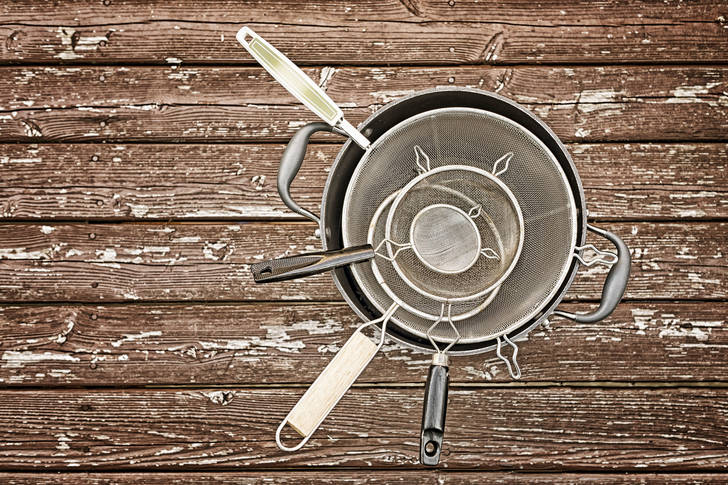Set of sieves on wooden background