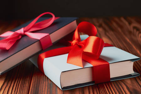 Books tied with a red ribbon