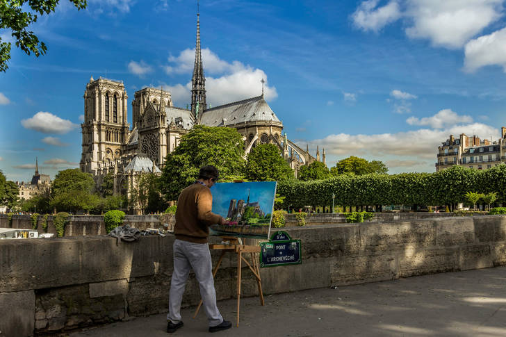 Artist paints Notre Dame Cathedral