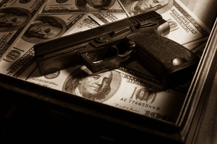 Gun and dollars